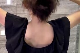 Brushing her silky hair to a ponytail