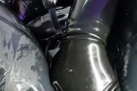 Rubber Girl Playing With Dildo