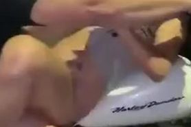 Crazy couple having sex on a Harley