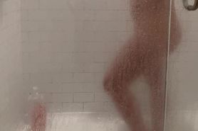 Wife caught in the shower starts playing with her body