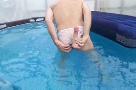 Slut in lace panties pleases her anus in the pool